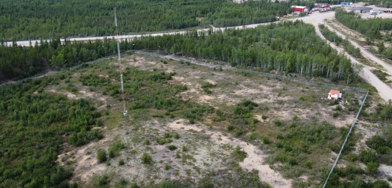 Aerial Image of a Radio Tower on a treed landscape remote