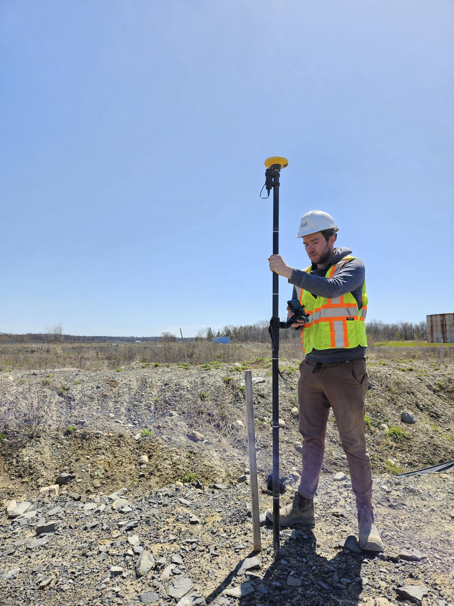 Environmental engineer surveying a property with an RTK